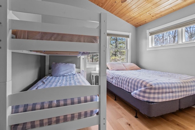 bedroom featuring wooden ceiling, wood finished floors, and vaulted ceiling