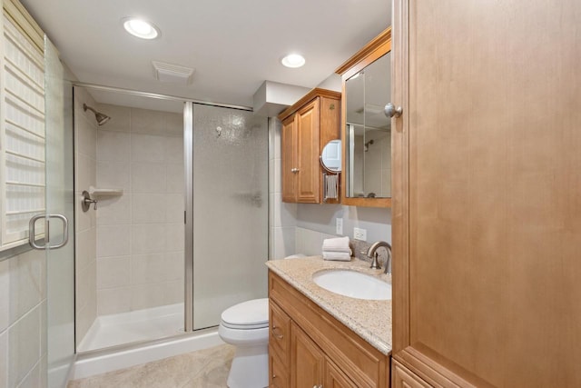full bath featuring a shower stall, vanity, recessed lighting, toilet, and tile patterned floors