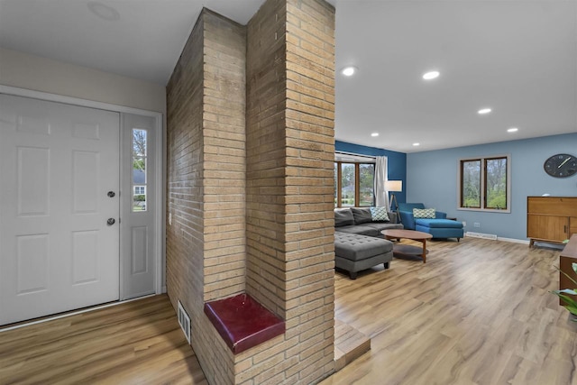 entrance foyer featuring visible vents, recessed lighting, light wood finished floors, and baseboards