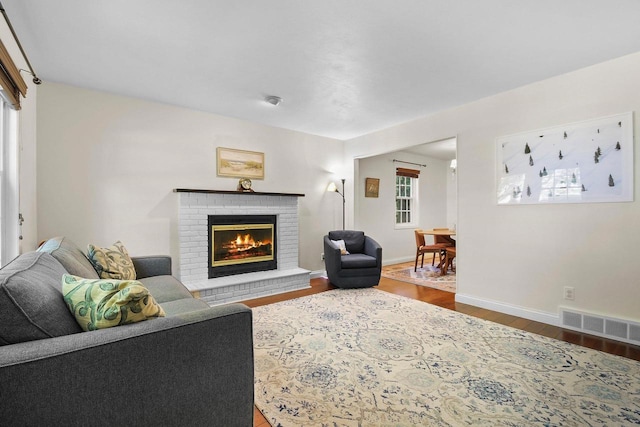 2 Oak Glen Ct, Madison, WI 53717 - living area with wood finished floors, a brick fireplace, and baseboards