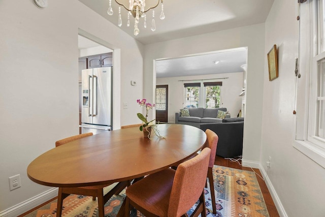 2 Oak Glen Ct, Madison, WI 53717 - dining area with baseboards, a chandelier, and wood finished floors