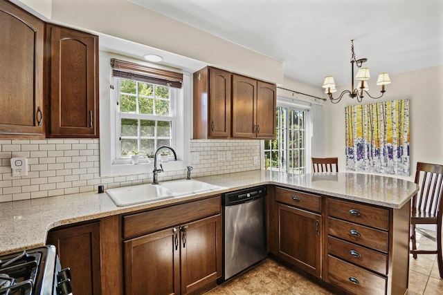 2 Oak Glen Ct, Madison, WI 53717 - kitchen with stainless steel dishwasher, a sink, a peninsula, a chandelier, and healthy amount of natural light