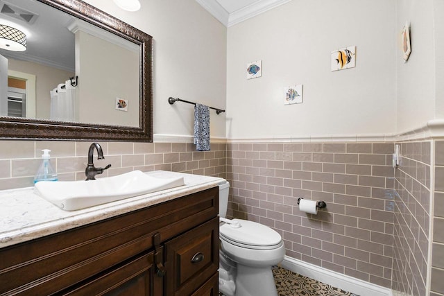 2 Oak Glen Ct, Madison, WI 53717 - bathroom featuring tile walls, vanity, ornamental molding, wainscoting, and toilet