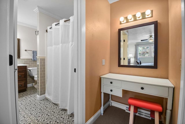2 Oak Glen Ct, Madison, WI 53717 - bathroom featuring ornamental molding, tile walls, vanity, wainscoting, and toilet