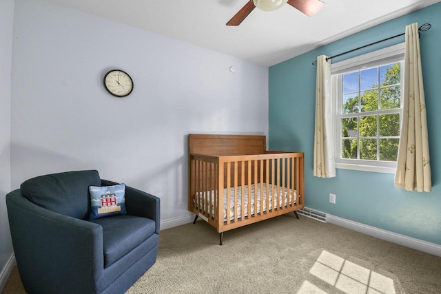 2 Oak Glen Ct, Madison, WI 53717 - carpeted bedroom with a nursery area, baseboards, and ceiling fan