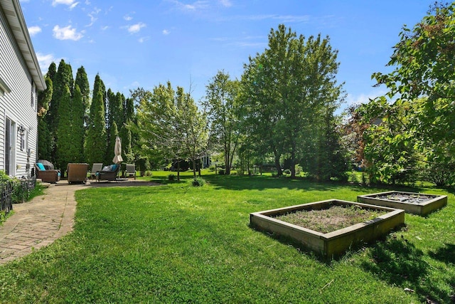 2 Oak Glen Ct, Madison, WI 53717 - view of grassy yard featuring a vegetable garden