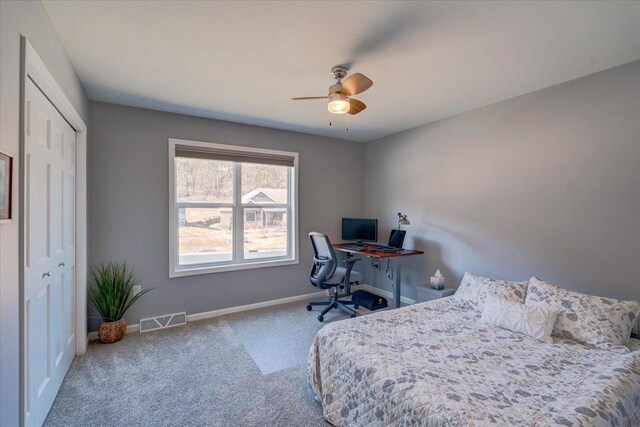 4062 Red Hawk Run, Black Earth, WI 53515 - carpeted bedroom with visible vents, baseboards, a closet, and ceiling fan