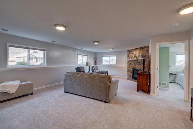 4062 Red Hawk Run, Black Earth, WI 53515 - carpeted living room featuring visible vents, baseboards, and a fireplace