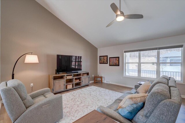 4062 Red Hawk Run, Black Earth, WI 53515 - living area with wood finished floors, high vaulted ceiling, and baseboards