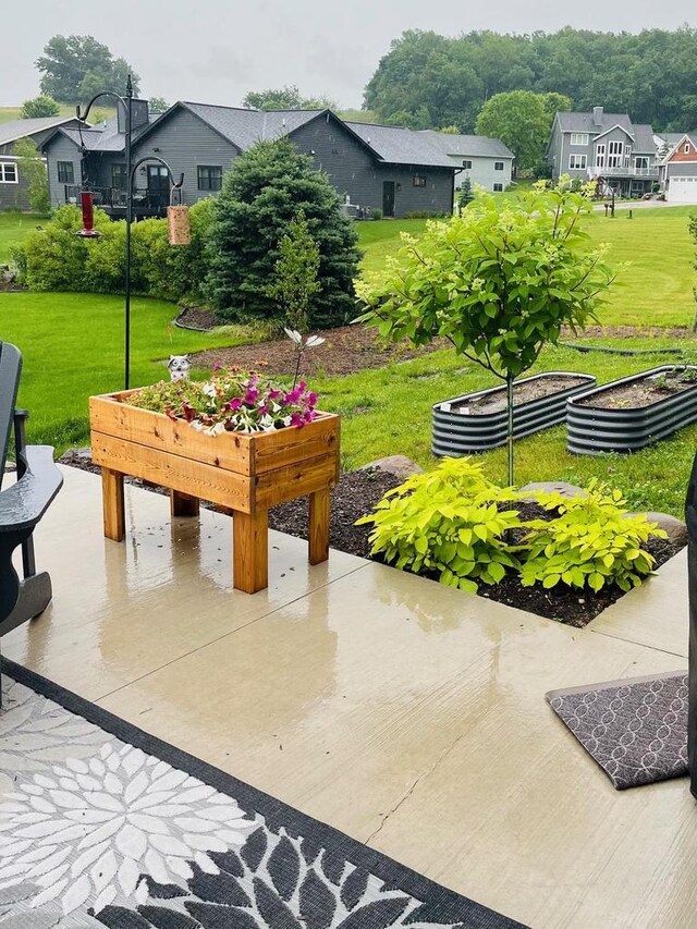 4062 Red Hawk Run, Black Earth, WI 53515 - exterior space featuring a garden and a residential view