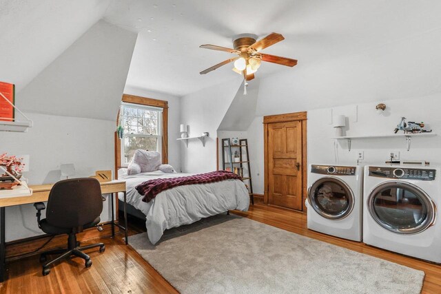 1015 E Johnson St, Madison, WI 53703 - bedroom with wood finished floors, washing machine and clothes dryer, a ceiling fan, and lofted ceiling