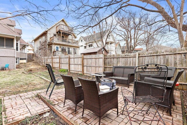 1015 E Johnson St, Madison, WI 53703 - view of patio / terrace featuring a residential view, stairway, a fenced backyard, and an outdoor living space with a fire pit
