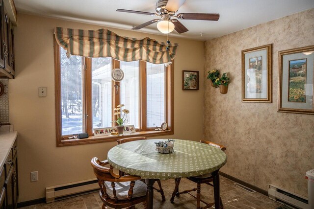 W5384 25th St, Necedah, WI 54646 - dining room with stone finish floor, baseboard heating, and baseboards