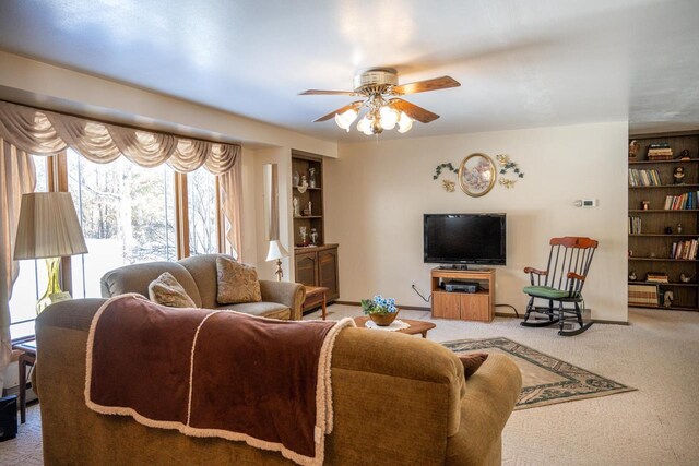 W5384 25th St, Necedah, WI 54646 - carpeted living area featuring a ceiling fan and built in shelves