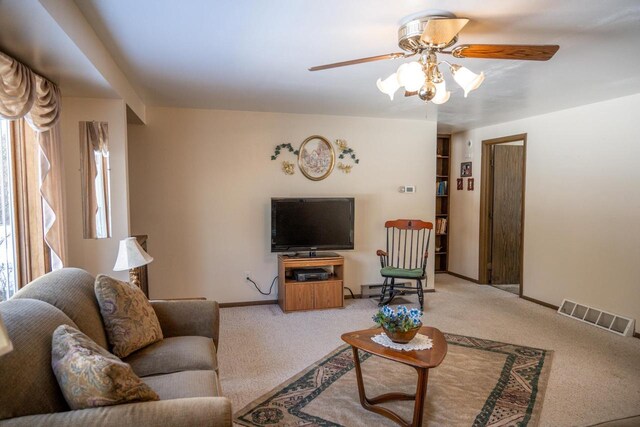 W5384 25th St, Necedah, WI 54646 - carpeted living area with visible vents, baseboards, and a ceiling fan
