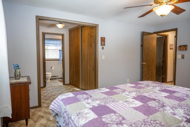 W5384 25th St, Necedah, WI 54646 - bedroom featuring light carpet, ensuite bathroom, a closet, and a ceiling fan
