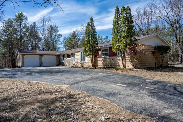 W5384 25th St, Necedah, WI 54646 - ranch-style home with a garage and aphalt driveway