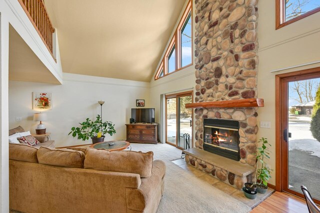 29323 Riverview Ln, Waterford, WI 53185 - living room with a stone fireplace and a high ceiling