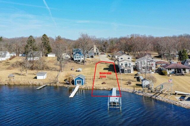 29323 Riverview Ln, Waterford, WI 53185 - drone / aerial view with a residential view and a water view