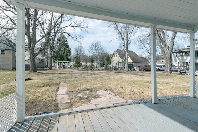 deck featuring a yard and a residential view