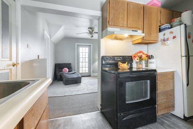 kitchen with ceiling fan, under cabinet range hood, wood finished floors, black / electric stove, and brown cabinets