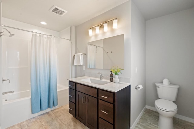 bathroom with shower / bath combo, toilet, vanity, baseboards, and visible vents
