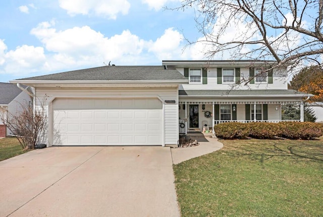 4530 Bleser Ct, Manitowoc, WI 54220 - traditional home with concrete driveway, roof with shingles, an attached garage, a front lawn, and covered porch