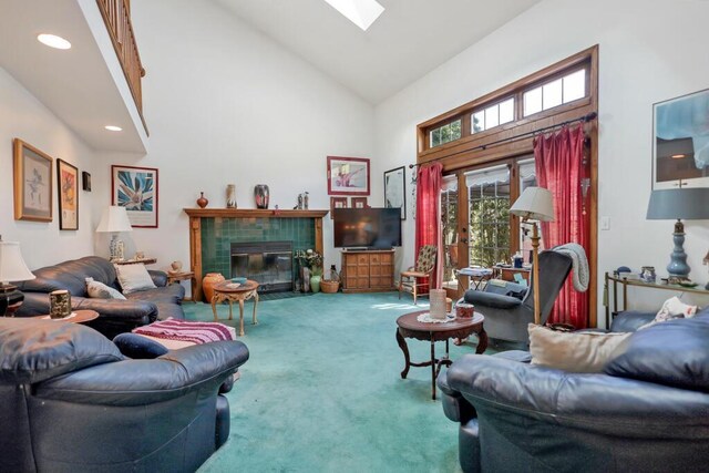 4530 Bleser Ct, Manitowoc, WI 54220 - living area with carpet, a fireplace, recessed lighting, a skylight, and high vaulted ceiling