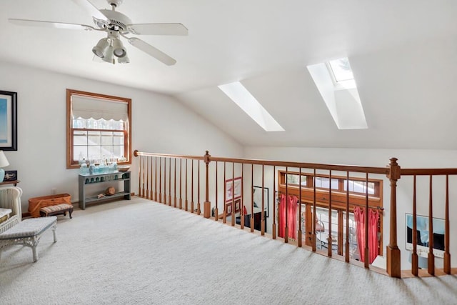 4530 Bleser Ct, Manitowoc, WI 54220 - additional living space featuring carpet flooring, a ceiling fan, and lofted ceiling with skylight