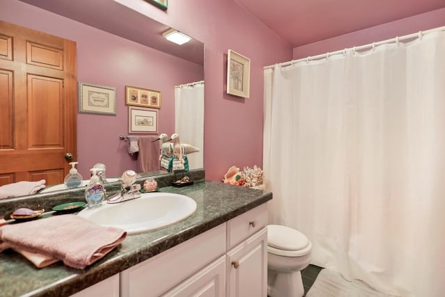 4530 Bleser Ct, Manitowoc, WI 54220 - full bath with tile patterned floors, toilet, curtained shower, and vanity