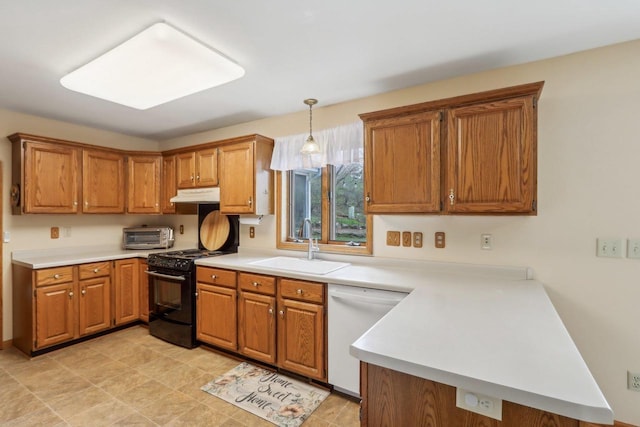 kitchen with under cabinet range hood, white dishwasher, black gas range oven, a sink, and a peninsula