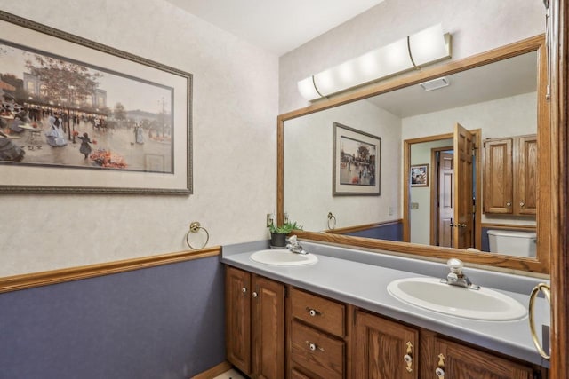 bathroom featuring double vanity and a sink