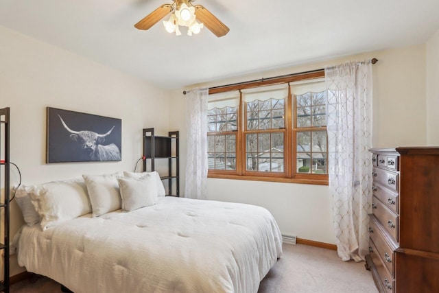 bedroom featuring baseboards, ceiling fan, and carpet floors
