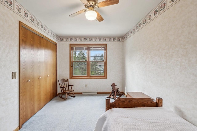 carpeted bedroom with visible vents, ceiling fan, and a closet