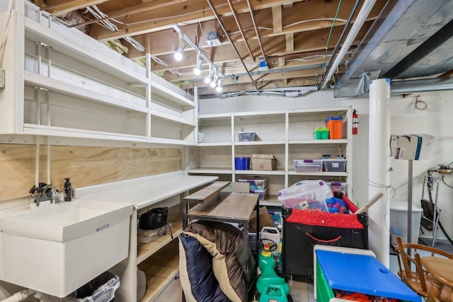 storage room with a sink