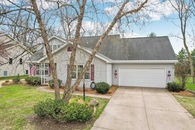 traditional-style home with driveway, roof with shingles, a front lawn, and a garage