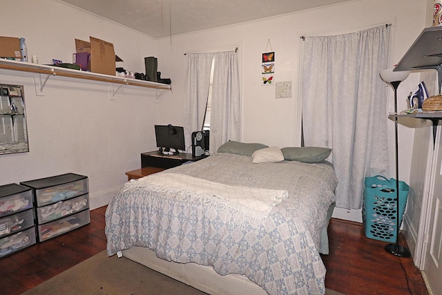 bedroom with wood finished floors