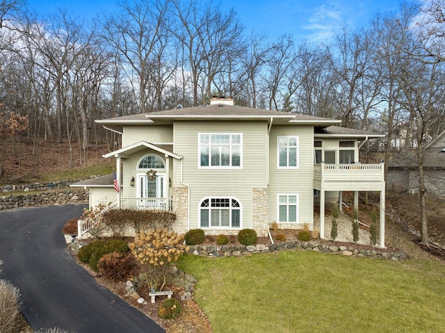 1066 Edinborough Ct, Lake Geneva, WI 53147 - view of front of property featuring roof with shingles, a chimney, and a front lawn