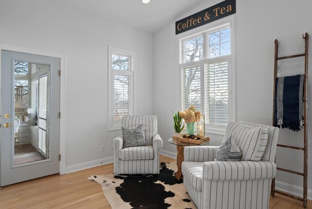 1066 Edinborough Ct, Lake Geneva, WI 53147 - living area featuring light wood-style floors, baseboards, and lofted ceiling