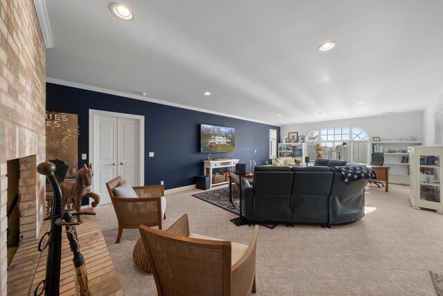 1066 Edinborough Ct, Lake Geneva, WI 53147 - living area with crown molding, light colored carpet, a brick fireplace, and recessed lighting