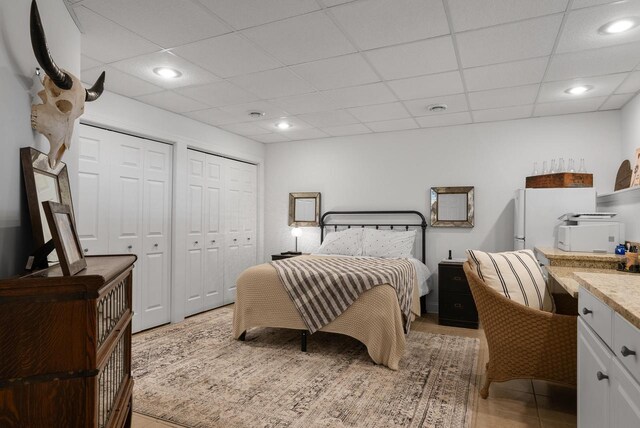 1066 Edinborough Ct, Lake Geneva, WI 53147 - bedroom with recessed lighting, a paneled ceiling, and two closets