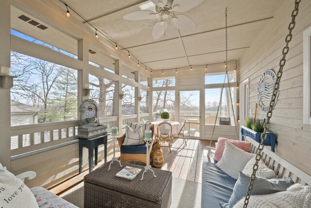 1066 Edinborough Ct, Lake Geneva, WI 53147 - sunroom / solarium with track lighting, ceiling fan, hardwood / wood-style flooring, and a healthy amount of sunlight