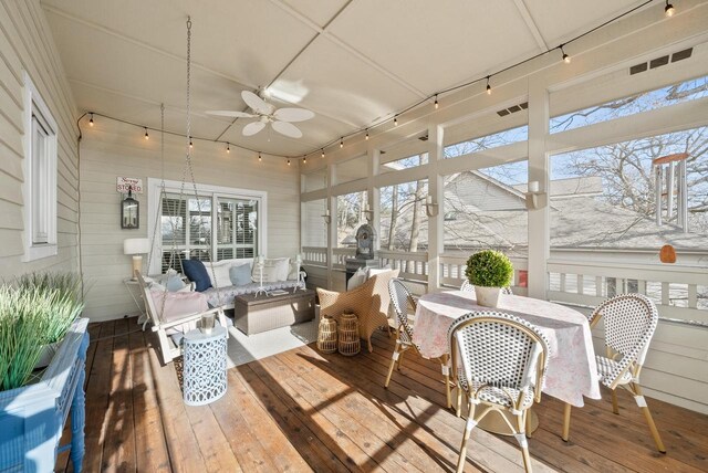 1066 Edinborough Ct, Lake Geneva, WI 53147 - sunroom with track lighting, a deck, and hardwood / wood-style flooring