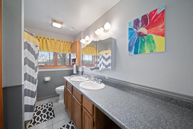 30847 Sun Ct, Burlington, WI 53105 - full bathroom with toilet, double vanity, a sink, and tile patterned flooring