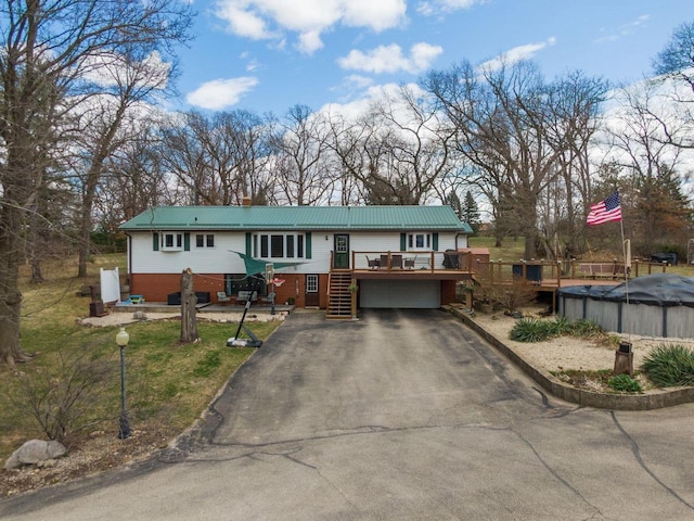 30847 Sun Ct, Burlington, WI 53105 - ranch-style home featuring a covered pool, driveway, a chimney, a deck, and an attached garage