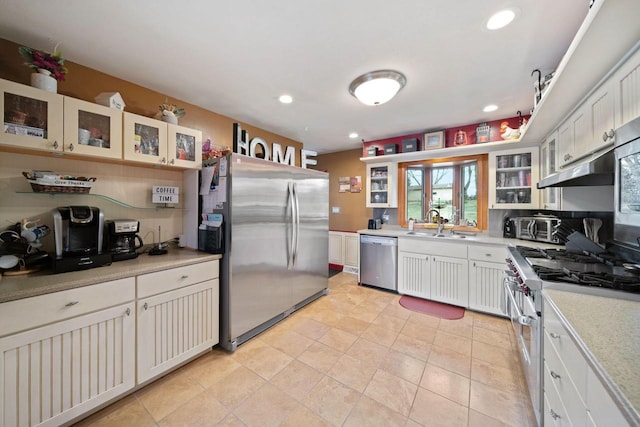 30847 Sun Ct, Burlington, WI 53105 - kitchen with glass insert cabinets, appliances with stainless steel finishes, light countertops, under cabinet range hood, and recessed lighting