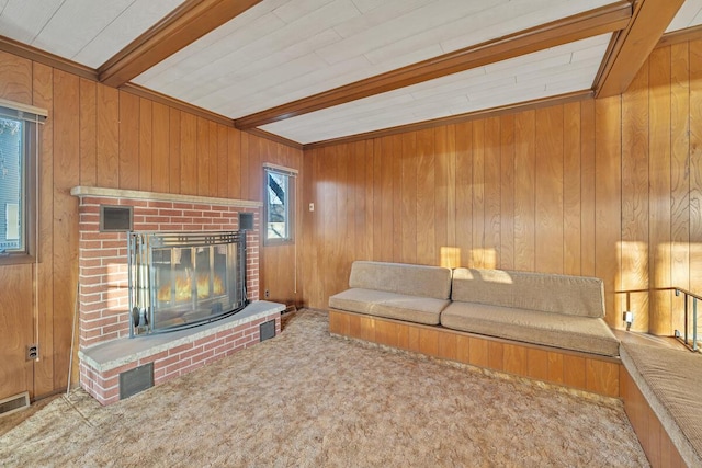 12606 234th Ave, Trevor, WI 53179 - living room with visible vents, carpet, a fireplace, beamed ceiling, and wood walls