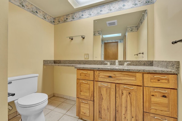 12606 234th Ave, Trevor, WI 53179 - bathroom with visible vents, toilet, tile patterned flooring, and vanity