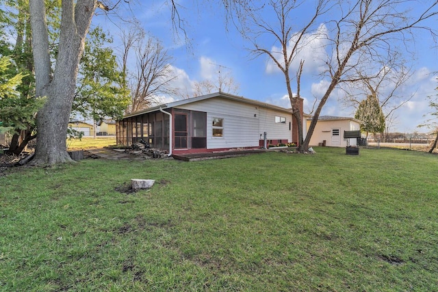 12606 234th Ave, Trevor, WI 53179 - rear view of house with a yard and a sunroom