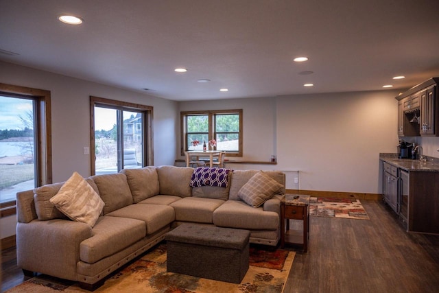 W5677 N Stone Gate Dr, New Lisbon, WI 53950 - living area featuring dark wood-style flooring, recessed lighting, and indoor wet bar